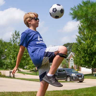 the kids knee band for osgood schlatter is flexible enough to wear while playing sports for support