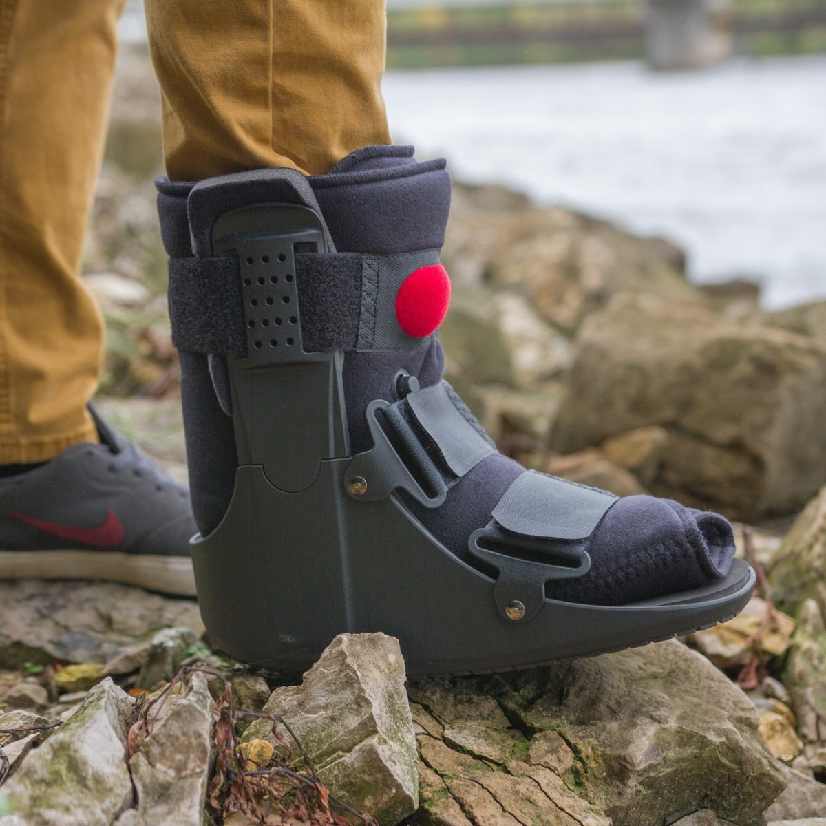 Short air walking boot has a low-profile polymer shell and innovative air cell technology