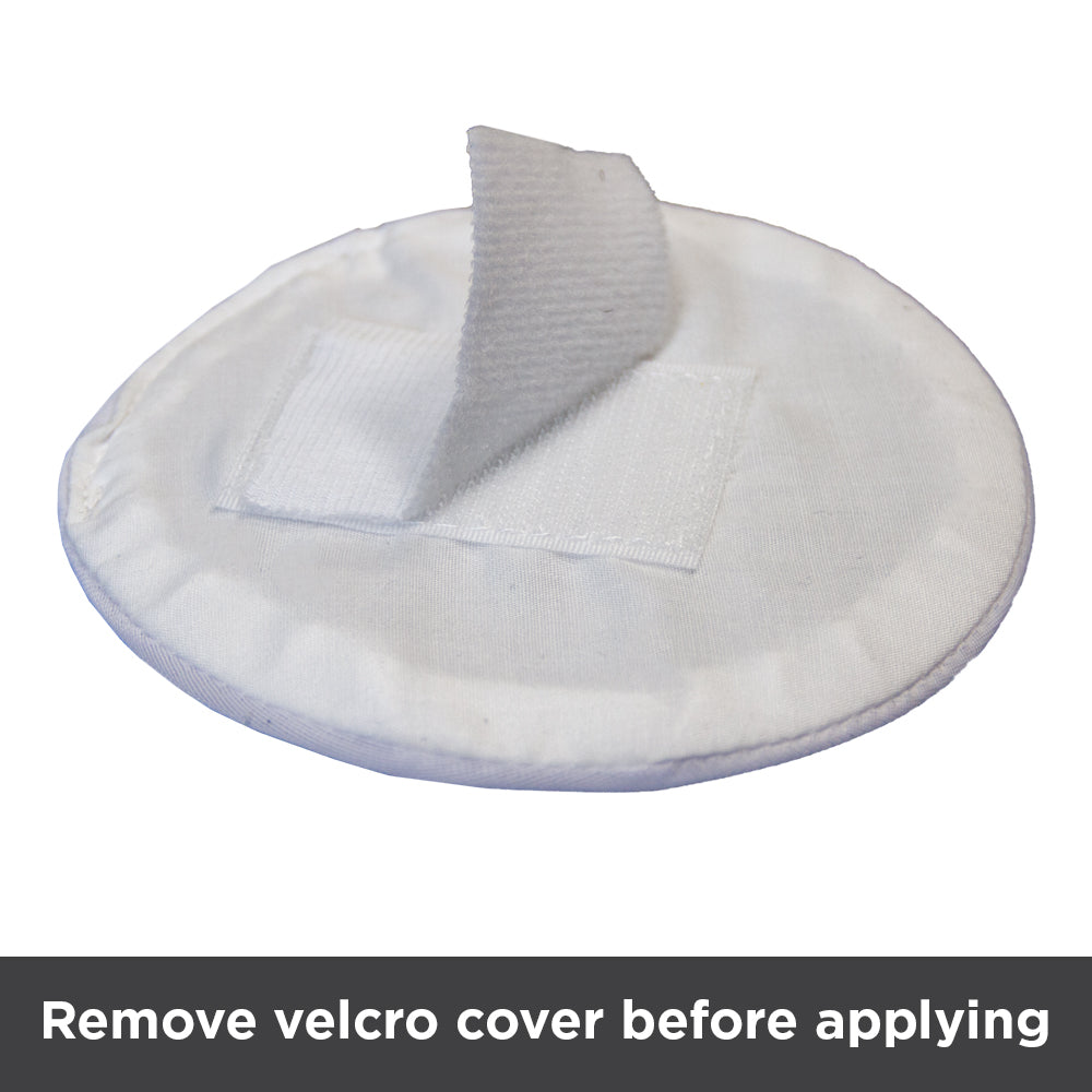 Remove Velcro cover on backside of hernia pad before applying