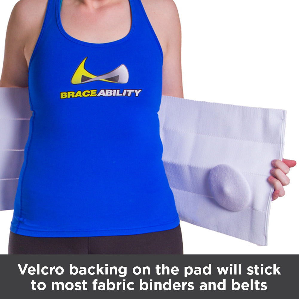 Velcro backings on the pad will stick to most fabric binders and belts
