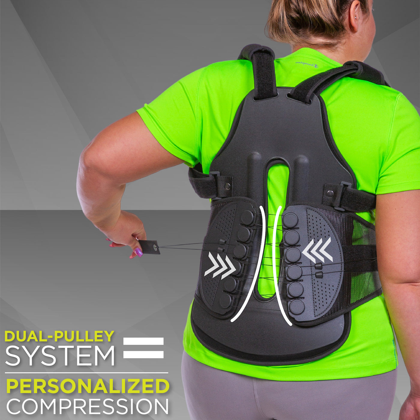 back straightener posture corrector has a mechanical advantage pulley system that compresses the spine